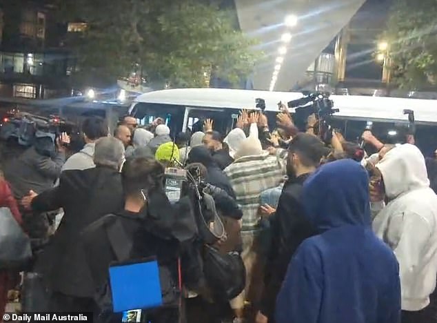 She got into a waiting minibus as the media pack surrounded the vehicle
