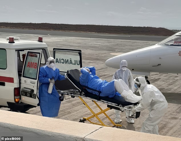 Pictured: A German passenger is evacuated from MV Hondius in Cape Verde