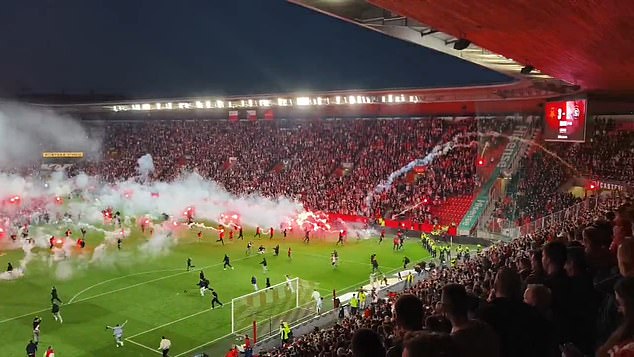 Slavia Prague fans invaded the pitch and hurled flares at opposition fans