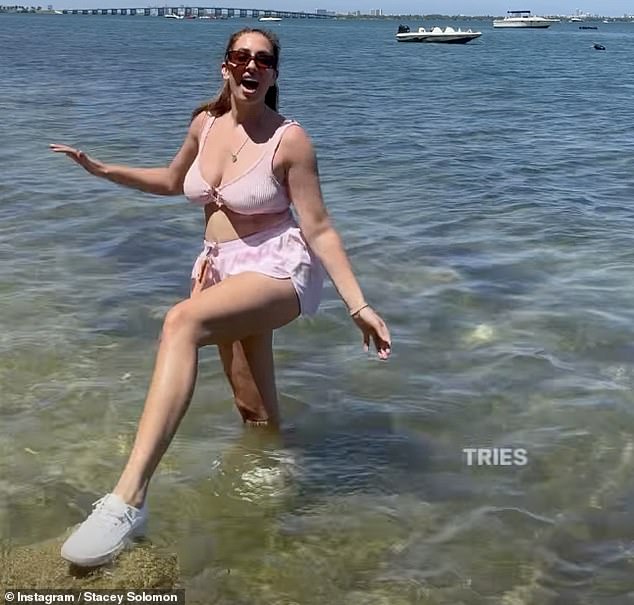 Sharing a fun glimpse at the trip, Stacey proudly showed off her waterproof trainers while larking about the sea