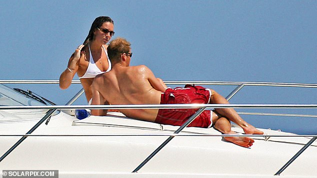 Pictured: the Prince and Princess of Wales onboard a boat in Ibiza in 2006