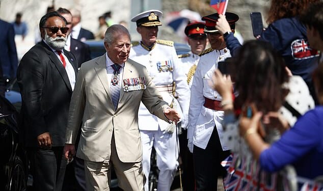 King Charles arrives for a ceremonial welcome at King's Square in St George's, Bermuda, today