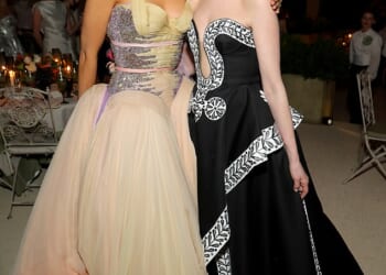 Anne Hathaway is facing fervent online backlash over photos of her posing with Blake Lively at Monday's star-studded Met Gala