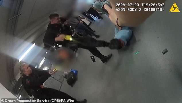 Firearms officer PC Zachary Marsden kicks Mohammed Fahir Amaaz, now 21, in the face during the fracas at Manchester Airport in July 2024 (pictured on footage from a colleague's body-worn camera)
