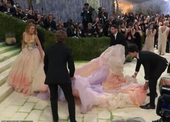 Blake Lively raised eyebrows on Monday's Met Gala red carpet after she appeared to share some stern words with the helpers assisting in lugging around her dress's massive train