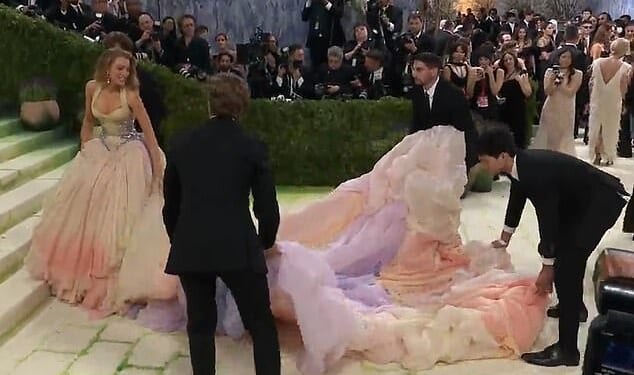 Blake Lively raised eyebrows on Monday's Met Gala red carpet after she appeared to share some stern words with the helpers assisting in lugging around her dress's massive train