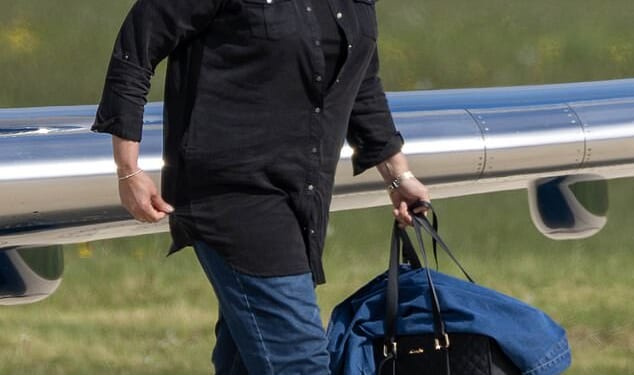 Miranda Hart was all smiles as she arrived in Scotland with her rarely-seen husband Richard Fairs on Sunday ahead of filming Celebrity Traitors