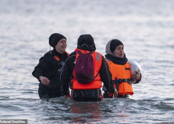 Belgian police chief Christiaan De Ridder has called for small boats leaving his country to be stopped by ¿a naval barrier¿ to prevent them ever reaching the UK. PIctured: Migrants preparing to board a small boat at Gravelines in North France on May 9, 2026