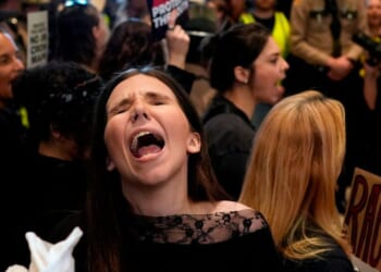 A woman protests outside the House chamber before a special session of the state legislature to redraw U.S. Congressional voting maps Thursday in Nashville, Tennessee.