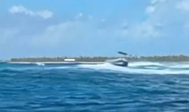 A tourist lost a leg and another was left seriously hurt after an unmanned diving boat spun out of control and sped over a group in the water when its skipper was knocked overboard. Pictured: The boat out of control