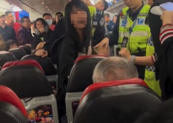 A woman, who claimed to be a flight attendant, started screaming on the plane
