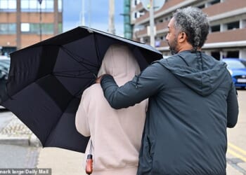Driver Deimante Ziobryte, 21, who killed Roman Casselden, 16, and his sister Darcie Casselden, nine, as they went through a junction on their e-scooter, hid her face behind an umbrella at court today