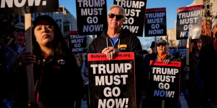 Protesters gather near the White House on Nov. 24 to rally against President Donald Trump.