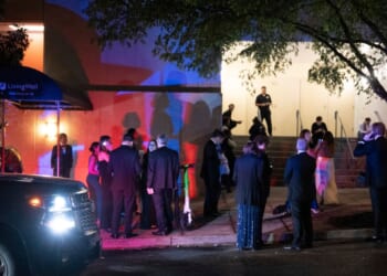 Guests evacuate the Washington Hilton during the White House Correspondents' Dinner after gunshots rang out on April 25, 2026, in Washington, D.C.