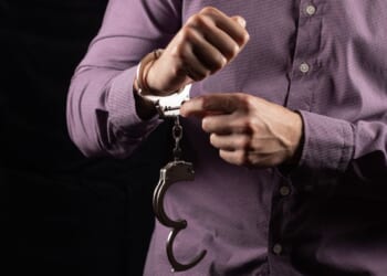 The judge ordered the man released, in spite of an international warrant for homicide and a recent arrest in connection with a violent crime.