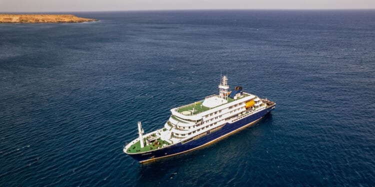 This aerial picture shows a general view of the cruise ship MV Hondius stationary off the port of Praia, the capital of Cape Verde, on May 3, 2026.