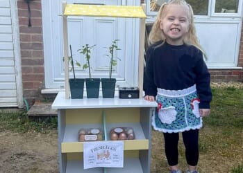 Maisie was all smiles as she posed next to her brand new stand. The heartbroken toddler's little business has been saved after Aldi donated its new wooden toy range to Maisie