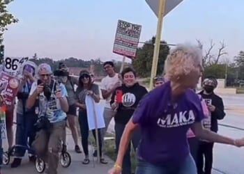 Footage re-circulating online, uploaded on Saturday, captured an older gray-haired protester at a roadside demonstration sporting a 'MAKA' shirt: Make America Kind Again