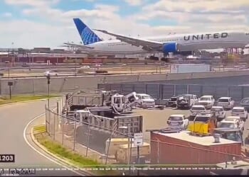 New video has shown the moment the United flight hit a light pole and a truck while landing at Newark Airport on Sunday