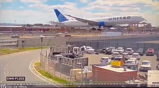 New video has shown the moment the United flight hit a light pole and a truck while landing at Newark Airport on Sunday