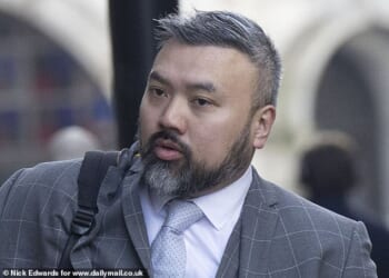 Peter Wai arriving at the Old Bailey, where he has been found guilty of running a Chinese 'state intelligence service' on British soil while working as a UK Border Force officer