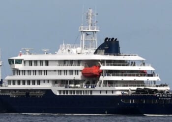 The MV Hondius cruise ship departs the port in Praia, Cape Verde, Wednesday.