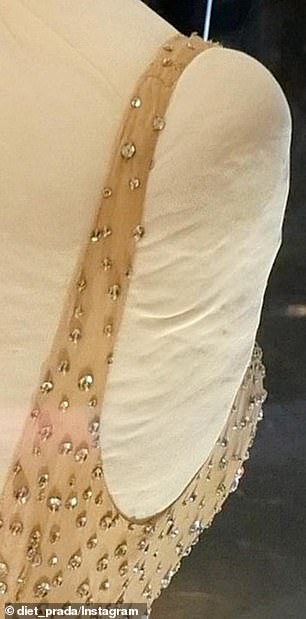 Images and video that were allegedly taken of the dress (pictured before it was worn by Kardashian) while it is on display at Ripley's Believe It or Not! show the 1962 gown with a visible tear at the back of the right strap