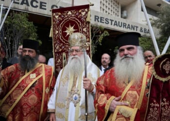 Christians in Bethlehem receive the Holy Fire at the Church of the Nativity after it arrived from the Church of the Holy Sepulchre in Jerusalem, on Holy Saturday according to the Eastern Orthodox calendar, on April 11, 2026.