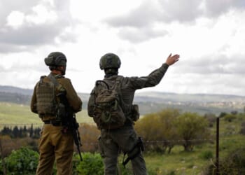 Israeli soldiers patrol along the Israel-Lebanon border on April 10, 2026.