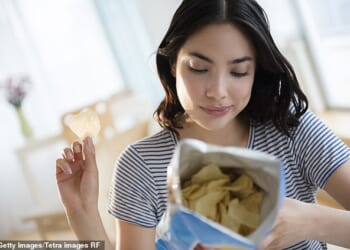 For every 10 percent increase in ultra-processed foods - one 'standard' packet of potato chips a day -participants had lower attention spans and a higher score of dementia risk factors (stock image)