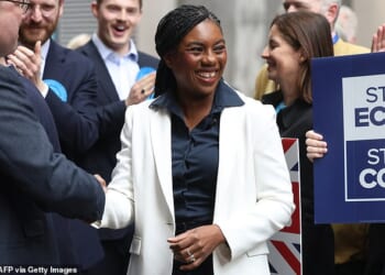 Conservative Party leader Kemi Badenoch smiles before a speech in Westminster