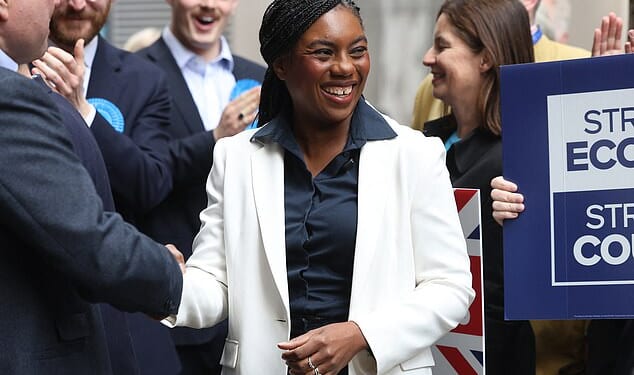 Conservative Party leader Kemi Badenoch smiles before a speech in Westminster