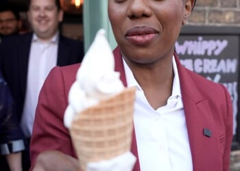 Conservative Party leader Kemi Badenoch holds an ice cream during a walkabout in Bexley, southeast London, while on the campaign trail for the upcoming local elections