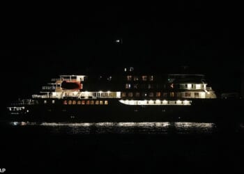 A night view of the MV Hondius cruise ship anchored at a port in Praia, Cape Verde