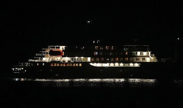 A night view of the MV Hondius cruise ship anchored at a port in Praia, Cape Verde