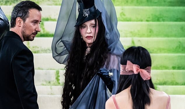 Madonna got annoyed with one of her seven pretty nymphs when at the Met Gala 2026 red carpet on Monday