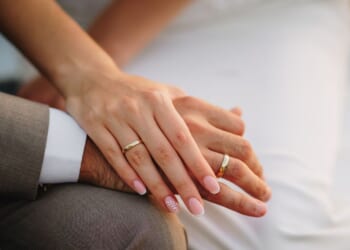 Newlywed hands close up.