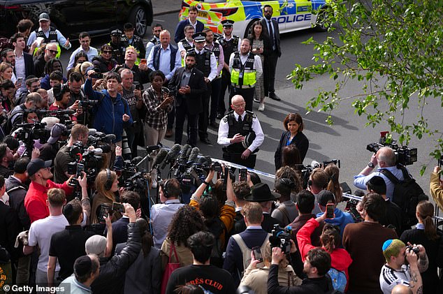 An aerial photo of the Met commissioner addressing reporters at Golders Green on Wednesday