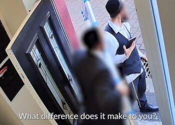 The two men, who were wearing kippahs, were entering a property in Bury last Wednesday when they were stopped by two men asking them questions