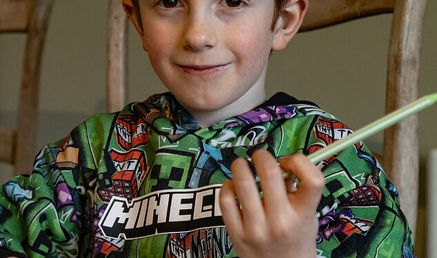 Little Rowan Antolovi (pictured), who has a rare genetic eye disorder, is struggling to manage in the classroom because of his failing eyesight