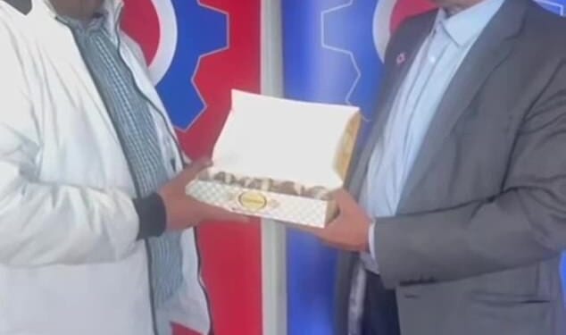 In a video posted online, Wajad Burkey and Sardar Khan (both pictured), both members of George Galloway's Workers Party of Britain, posed with a box of sweets and praised Iran after it blocked the Strait of Hormuz