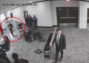 The alleged shooter carried a 12-gauge shotgun through the hotel