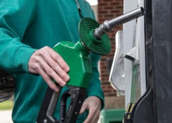 A person pumps gas at a gas station on April 30, 2026.