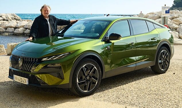 Touch of flare: Ray with the 408 in its new green paint, which changes colour in the light