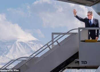 Sir Keir Starmer boards a plane following the European Political Community summit in Yerevan, Armenia today