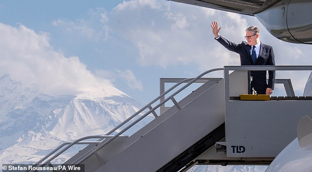 Sir Keir Starmer boards a plane following the European Political Community summit in Yerevan, Armenia today