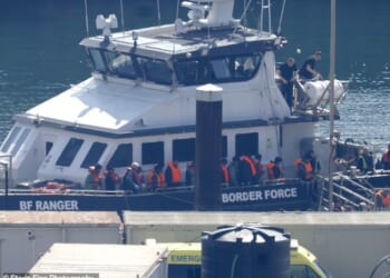 Historic figure: Among the people brought ashore by Border Control yesterday is the man believed to be the 200,000th small-boat migrant, circled
