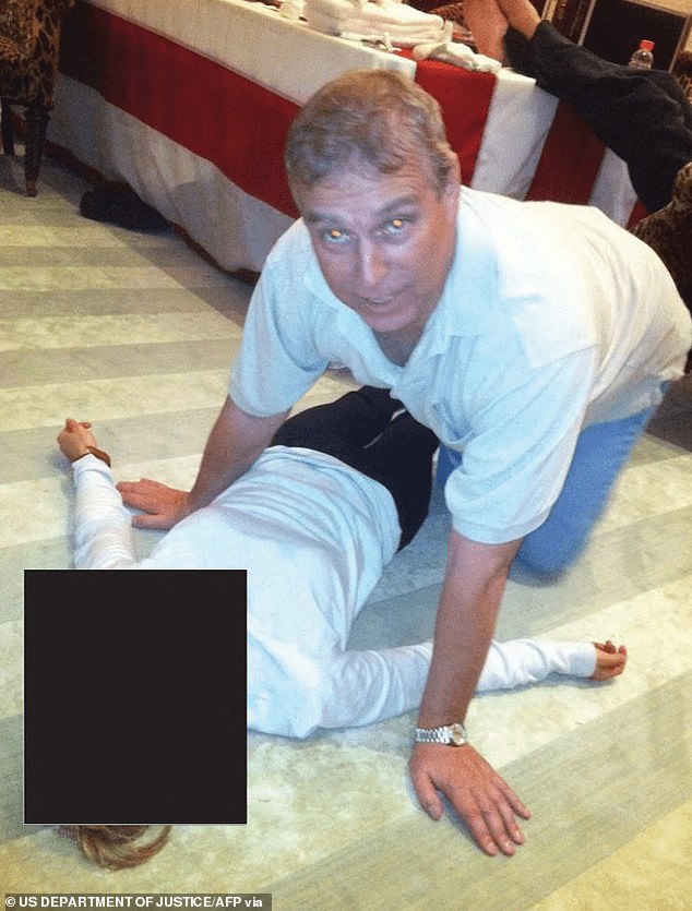 Andrew kneeling over a woman lying on the floor in one of a tranche of photographs released by the FBI in the Epstein Files earlier this year