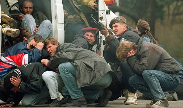 Gun-toting enthusiasts who travelled thousands of miles to shoot at innocent civilians for fun during the siege of Sarajevo competed to see who could kill the most beautiful women, a new book claims. Pictured: Civilians under fire in Sarajevo, 1992