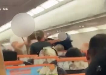 Footage shows a drunken brawl on board a flight from London's Gatwick Airport to Antalya, Turkey